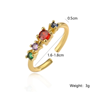 Macro shot of gold-plated ring with four multi-colored zircon stones and dimensions