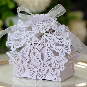 Detailed view of lavender butterfly laser cut wedding favor box with white ribbon