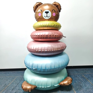 Detail of a 5-tier colorful balloon tower featuring a cute brown bear head and paws