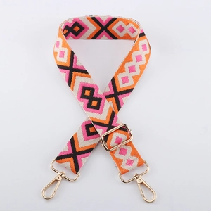 Detail of adjustable 38mm bag strap with colorful diamond pattern and gold hooks
