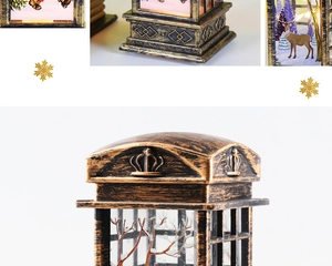 Detail of bronze retro Christmas phone booth lantern with reindeer glass and crown relief