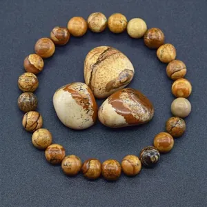 Detailed view of natural picture jasper stone beads with unique earthy landscape patterns