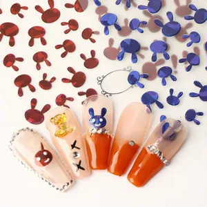 Detail of TH-105 rabbit head nail stickers in red and blue chrome finish on gradient nails
