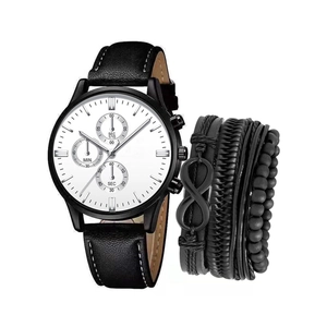 Macro view of men's chronograph watch with white dial and woven leather bracelet