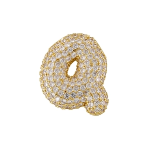 Macro shot of 3D bubble letter Q pendant in gold copper with micro-paved sparkling crystals
