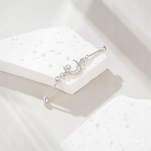 Detailed close-up of S925 sterling silver industrial barbell with star moon zircon
