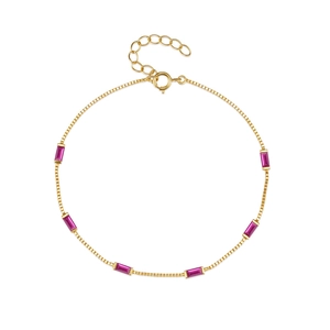 Detailed close-up of golden chain bracelet featuring six rectangular magenta zircon stones