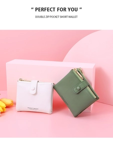 Detail view of pink and green PU leather short wallets with double zipper pockets