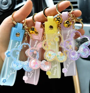 Colorful acrylic cherry blossom keychains with flowing liquid and glitter detail