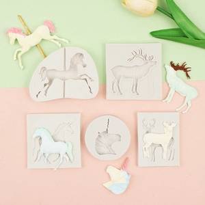 Detail view of unicorn and carousel silicone molds with finished animal soap samples
