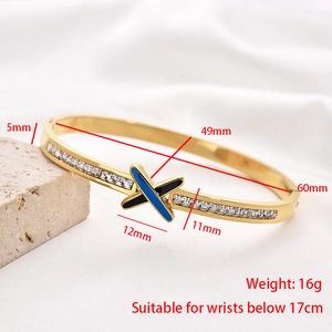 Detailed view of bicolor crossover bangle with inlaid crystals and dimension markings