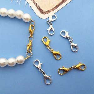 Detailed view of dual-ended lobster clasps in gold and silver for DIY jewelry making