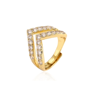 Macro view of gold V-shaped ring featuring sparkling micro-pave zircon crystals and adjustable band