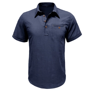 Detail of navy cotton linen shirt showing wood buttons and textured breast pocket