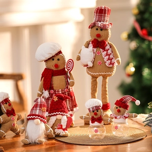 Charming Gingerbread Man and Christmas Gnome figurines with red and white festive holiday decor