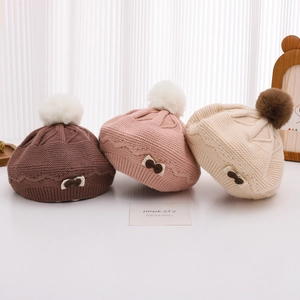 Winter knitted beret for girls with bow lace details and large fuzzy pompom in three colors
