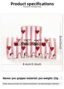 Detailed view of hair claw clip dimensions 8.4x5cm with red heart patterns and black bow