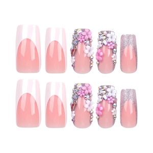 Pink French tips press-on nails with 3D white flowers and silver glitter on white background