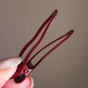 Burgundy geometric pleated hair clip in glossy finish with secure metallic grip