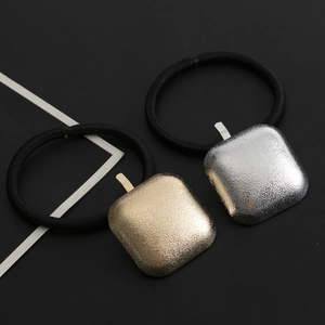 Minimalist square metal hair ties in gold and silver matte finishes with black elastic bands
