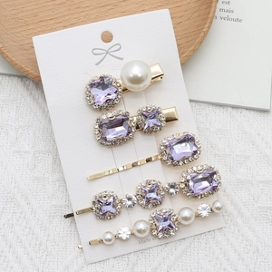 Detailed set of 5 purple crystal and pearl hair clips with elegant gold alloy finish