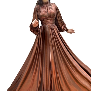 Metallic bronze long sleeve evening gown with pleated waist and high slit design