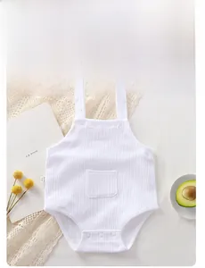 Detail of white ribbed cotton baby bodysuit with straps and resin snap fasteners