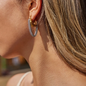 Minimalist 18K gold stainless steel U-shape earrings with silver chain tassels on a model