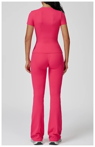 Back view of slim fit rose pink yoga set showing high elasticity and contoured design