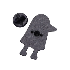 Detailed back view of a metal brooch featuring geometric texture and a black rubber clutch