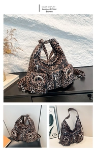 Detail view of Leopard Brown canvas tote with silver ring hardware and multi-pocket design