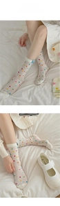 Close-up of breathable mesh cotton socks with colorful polka dots and puppy label
