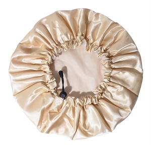 Detail of champagne satin shower cap showing silky texture and adjustable black buckle