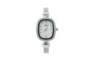 Detail of silver mesh band watch with rhinestone oval bezel and marble dial