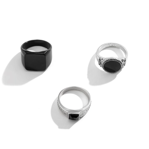 Three-piece men's vintage ring set with black gemstone and silver engraved bands