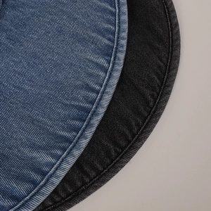 Detail view of premium twill denim fabric and curved stitched edges for sun visors