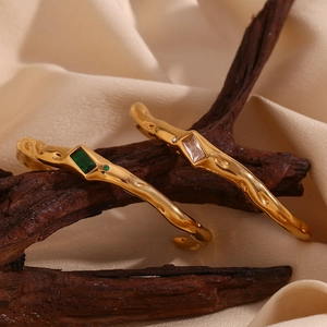 Irregular 18K gold plated open cuff bracelet with emerald and white zircon gemstones