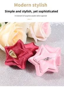 Detailed view of star-shaped velvet jewelry boxes in dark red and pink with ring slots