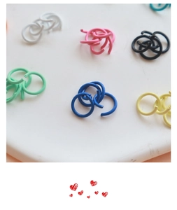 Close-up of assorted matte lacquer open jump rings for DIY jewelry making crafts