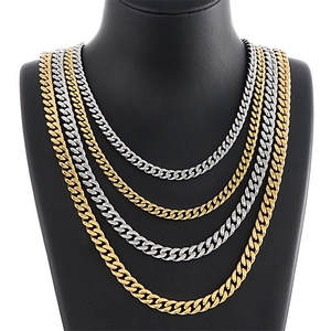Hiphop style Cuban chain necklace set in gold and silver finish on mannequin stand