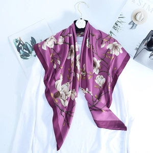 Purple silk scarf with white magnolia floral print and silky texture for elegant women