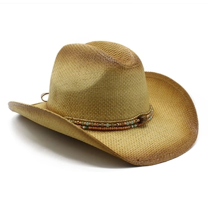 Straw cowboy hat with ethnic beads and distressed finish in a high-angle side view