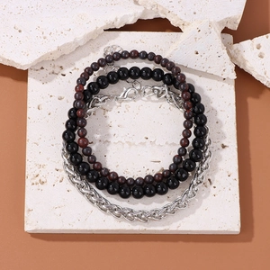 Set of three men's bracelets featuring natural rhodochrosite beads and silver Cuban chain