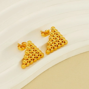 Golden triangle stud earrings with stacked metallic beads on white textured background