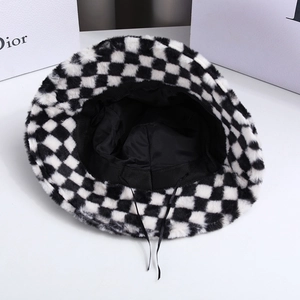 Detail view of plush checkered bucket hat showing black lining and adjustable inner drawstring