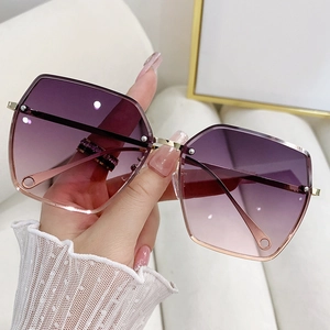 Oversized rimless sunglasses for women with purple gradient lenses and gold metal frames