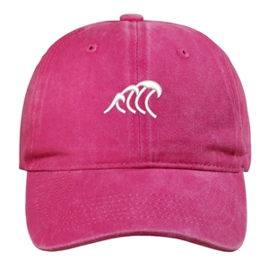 Detailed view of pink washed denim baseball cap with white wave embroidery