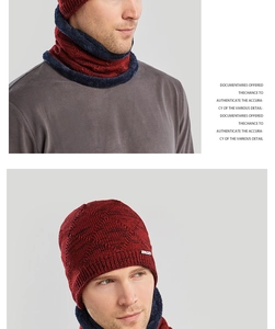 Detail of burgundy and navy knit beanie set with thick plush fleece lining and logo label