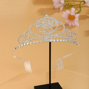 Detailed view of silver graduation crown tiara featuring sparkling GRAD lettering and rhinestones