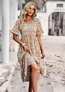 Detail of floral V-neck dress with layered ruffles and yellow wildflower pattern